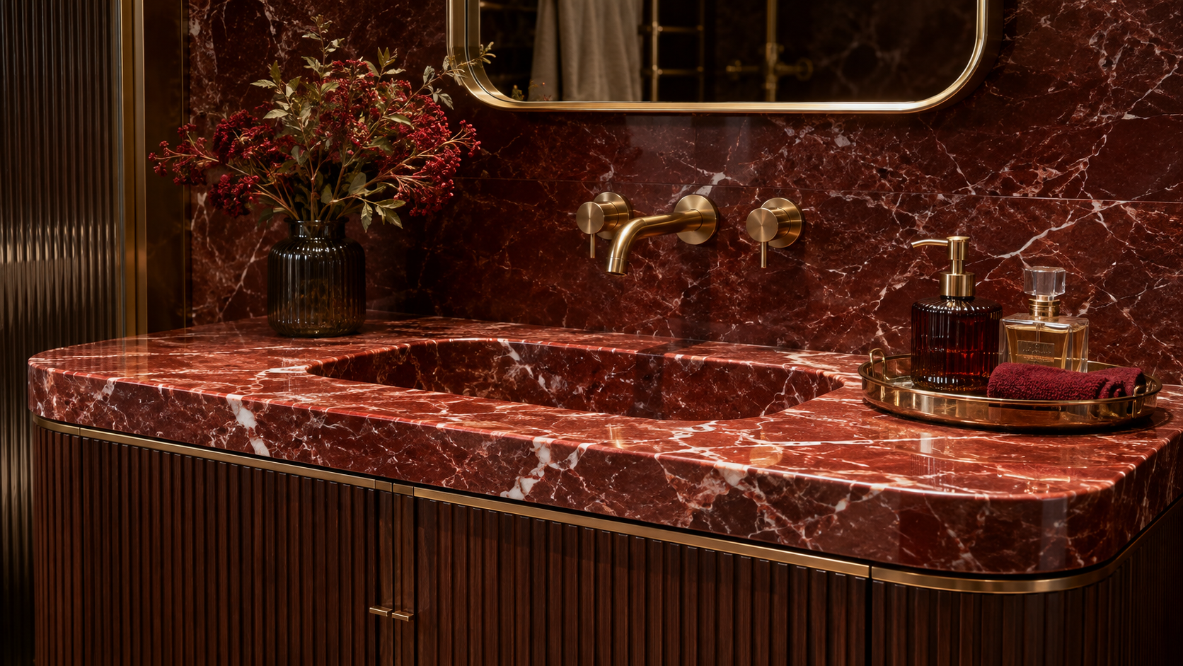 Red marble sink vanity area with custom fluted wood cabinetry details